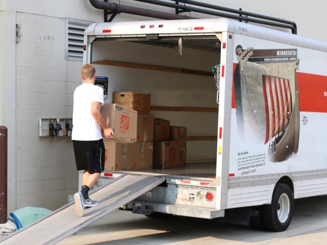 Mover in College Station unloading a rental truck