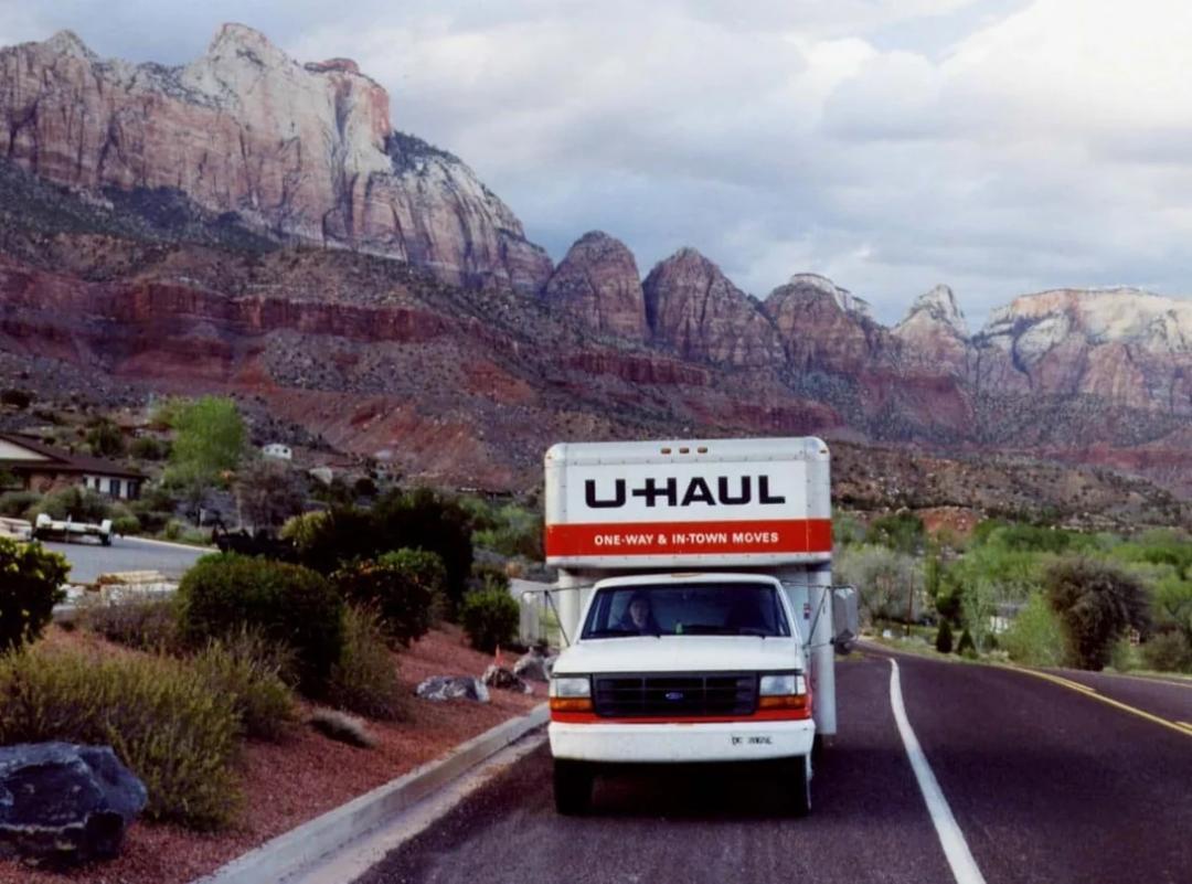 A U-Haul truck on a lonely highway