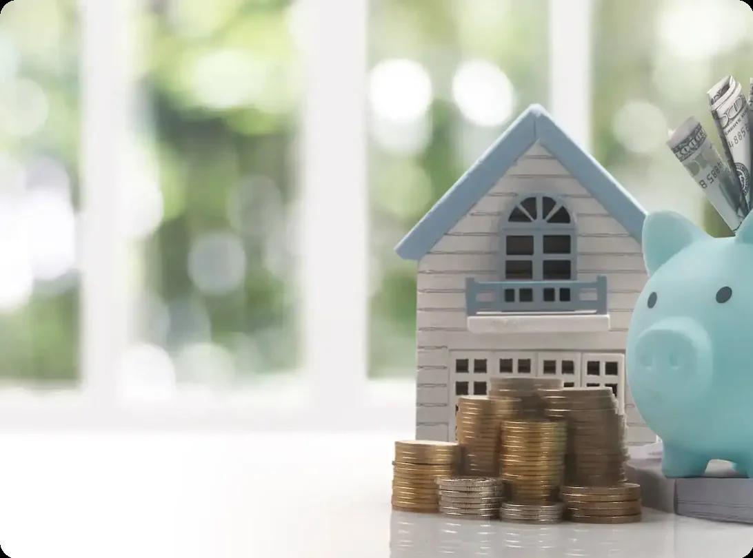 A piggy bank and a toy house
