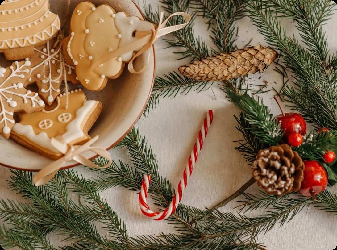 A festive table adorned with an assortment of Christmas cookies and colorful decorations, creating a joyful holiday atmosphere.