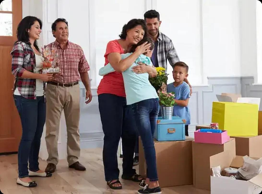 Family settling into new home in Charlotte NC, surrounded by moving boxes