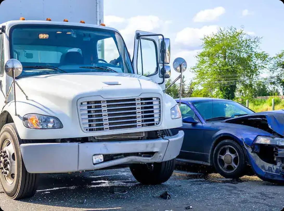 Damaged car and rental truck after a road accident.