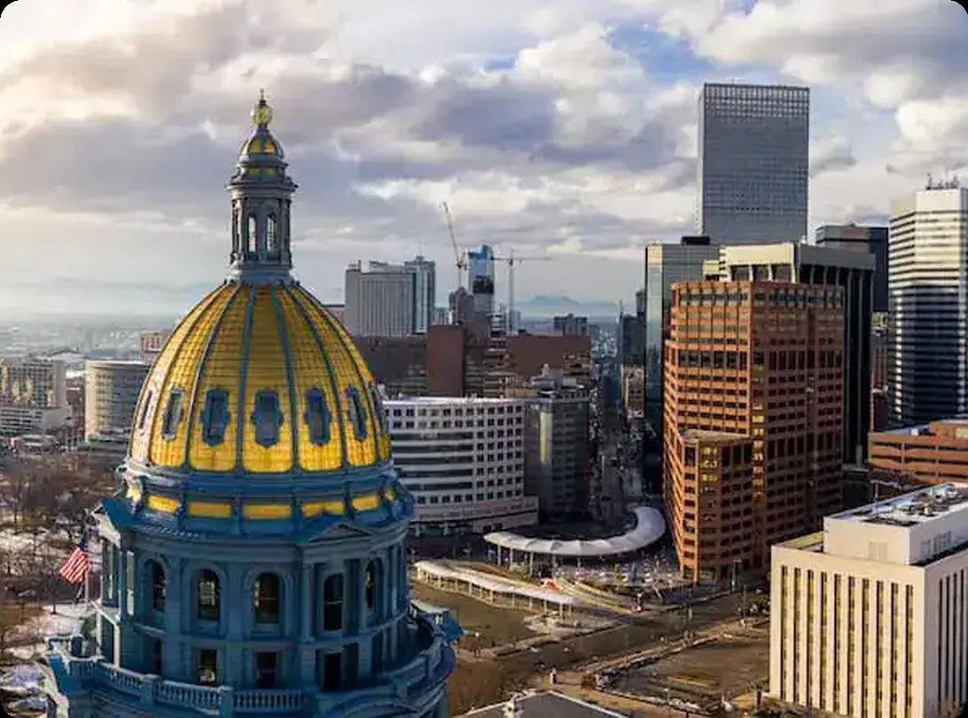 Denver skyline with State Capitol building and cityscape in the background