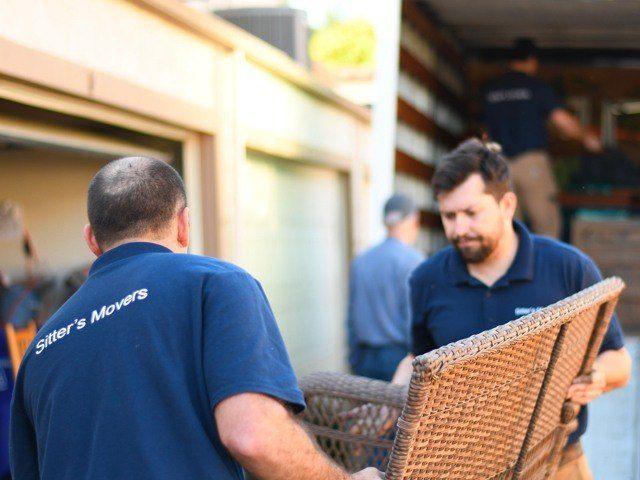 movers carrying furniture