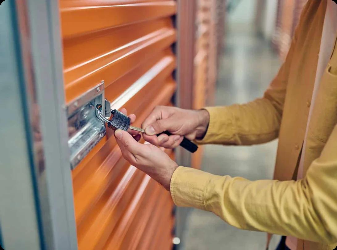 a person locks up their storage unit
