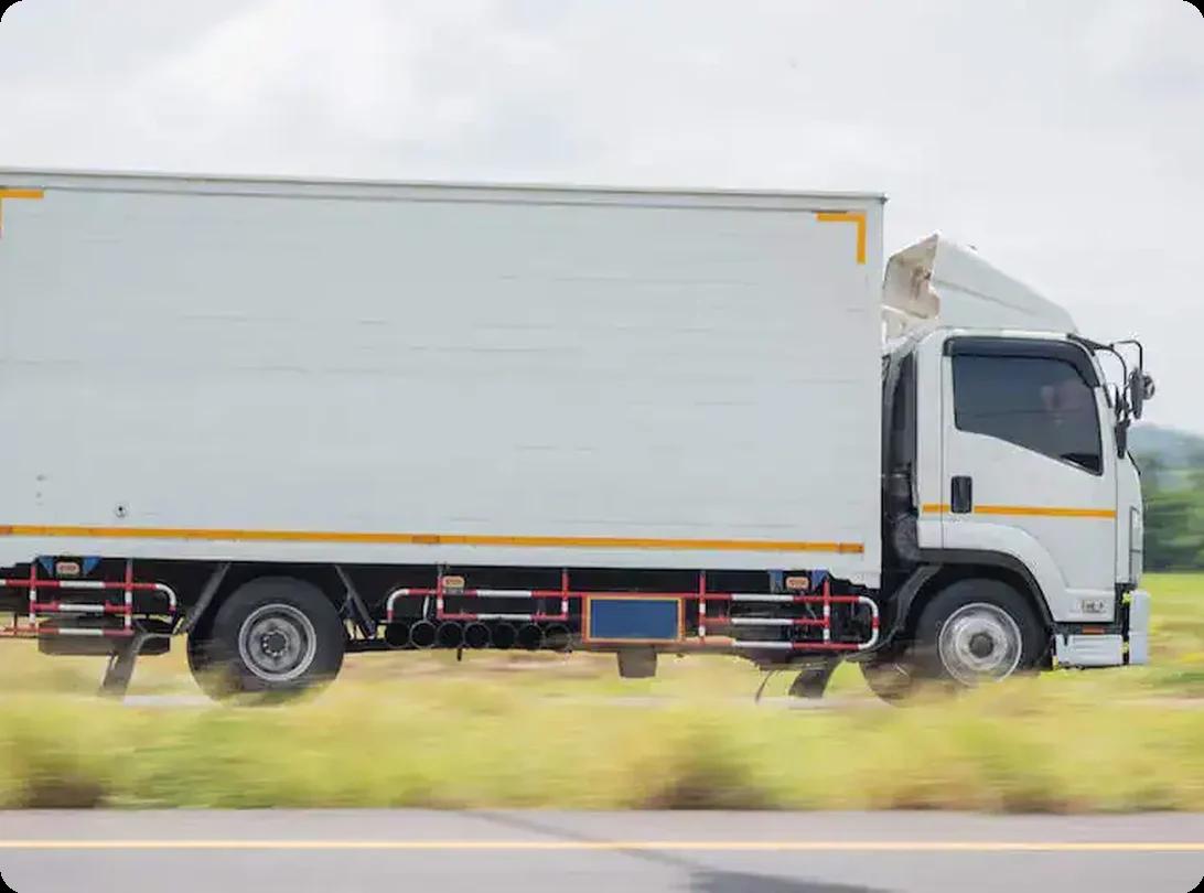 Moving truck driving on highway