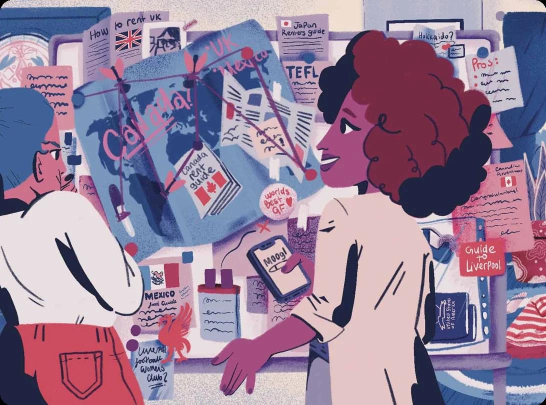 Two women looking over an international map