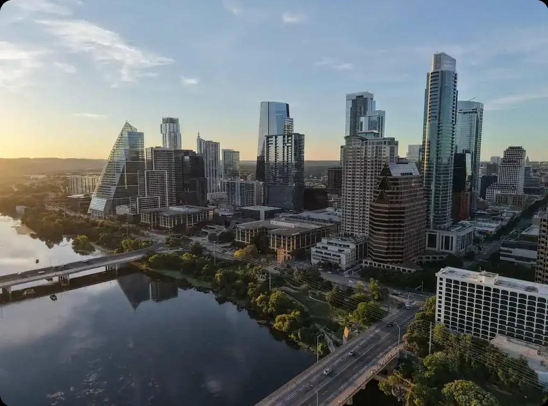 Austin TX city skyline at sunset viewed over the river