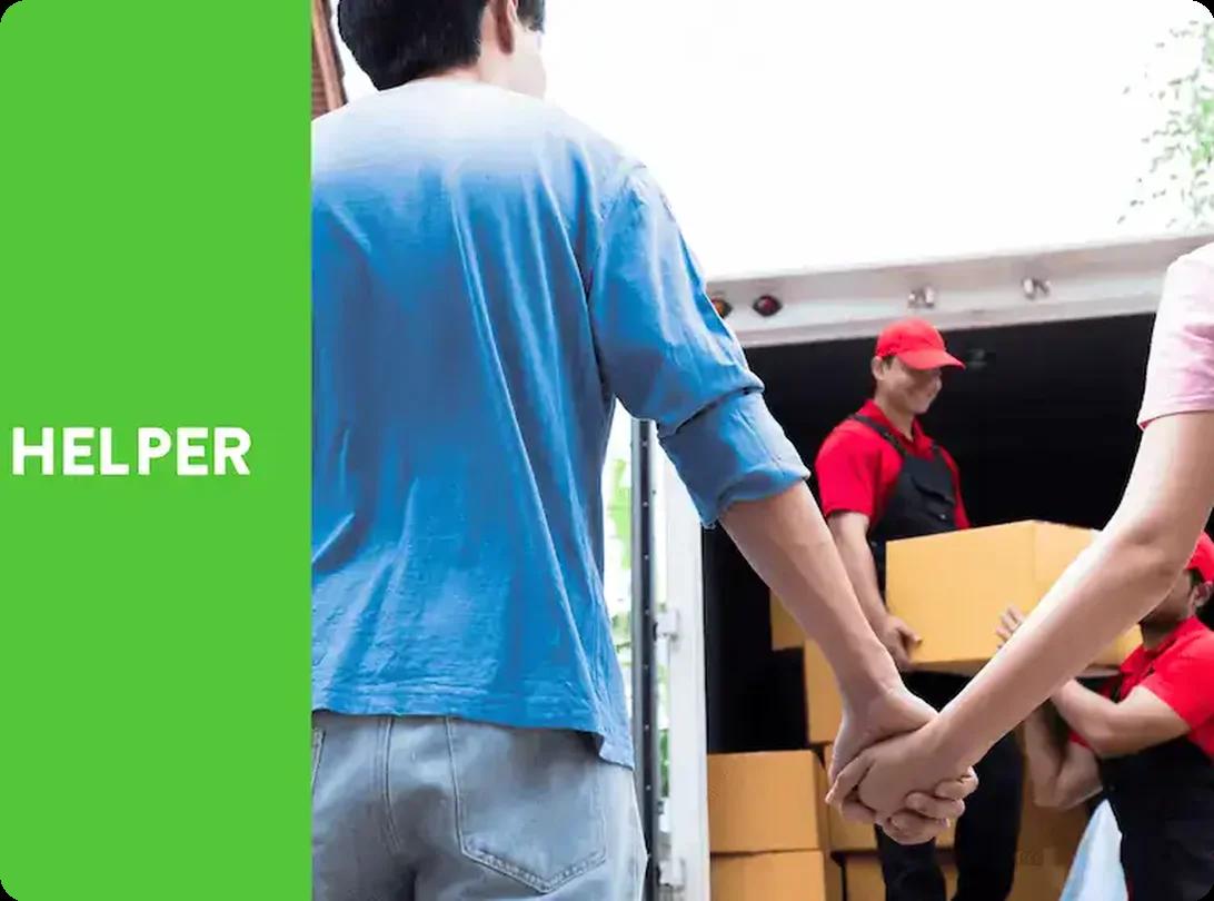 HireAHelper movers helping a couple move boxes into a truck