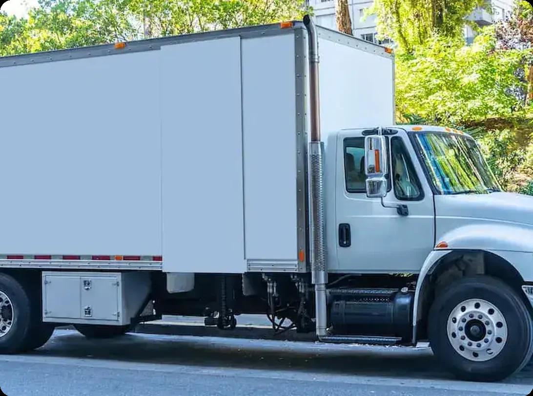 A parked moving truck on a city street