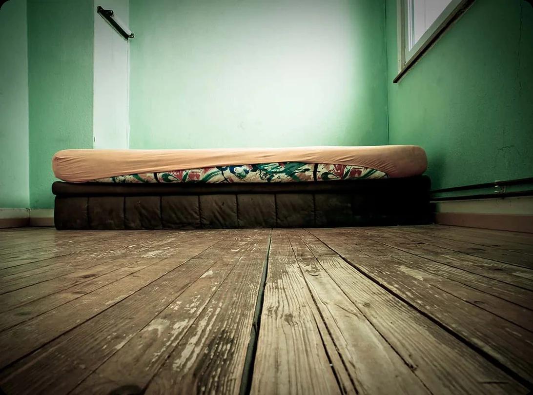 an image of a queen mattress on a wooden floor