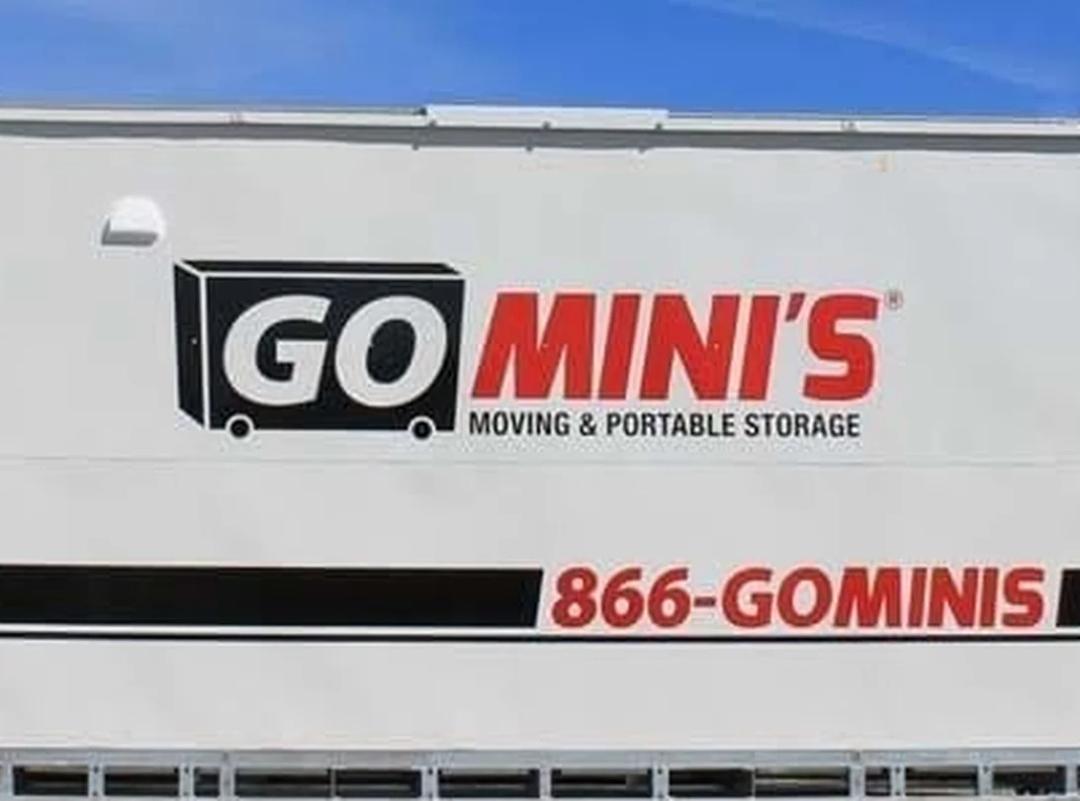 a go mini's steel moving and storage container parked in a residential driveway