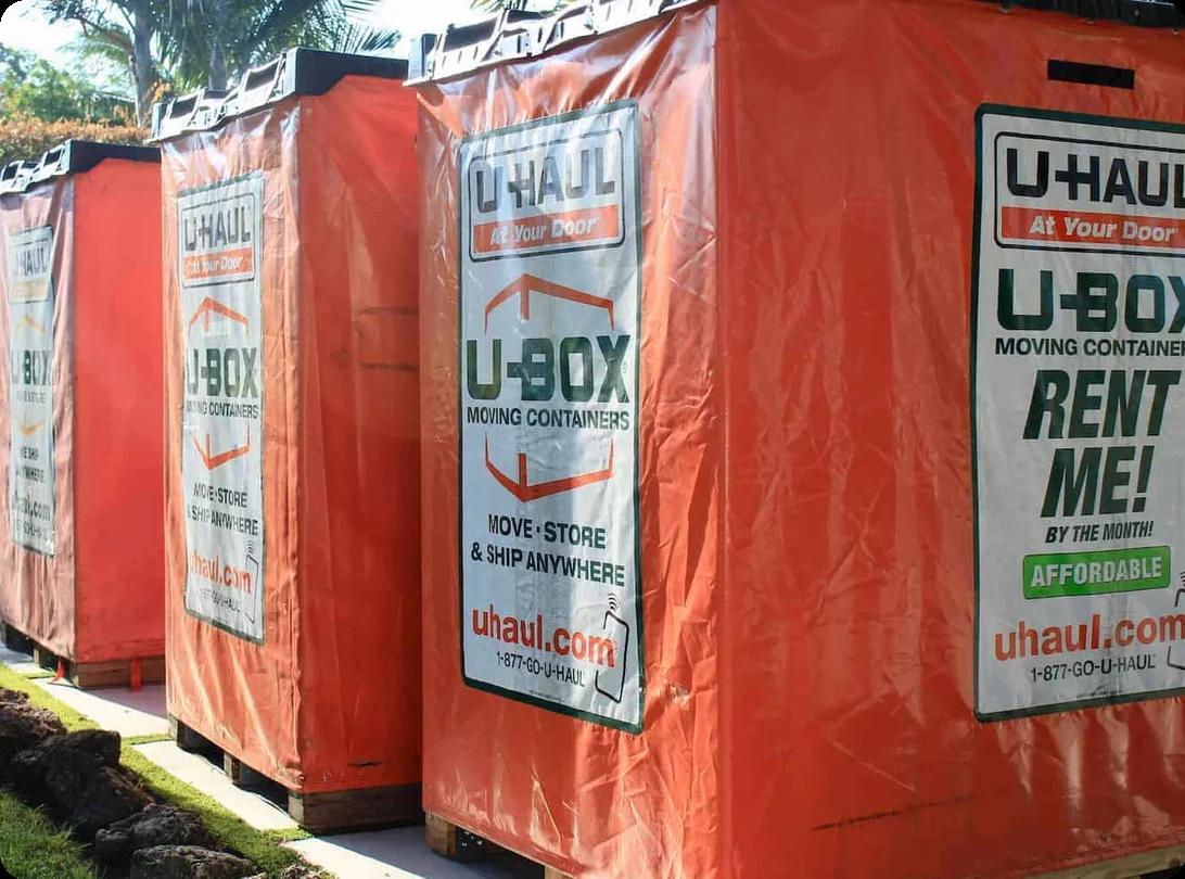 An image of four U-box units set in a row on a curb