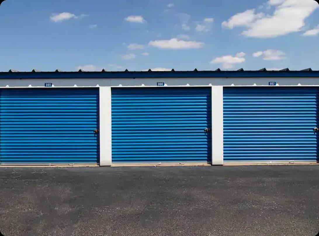 A row of self-storage units with blue doors