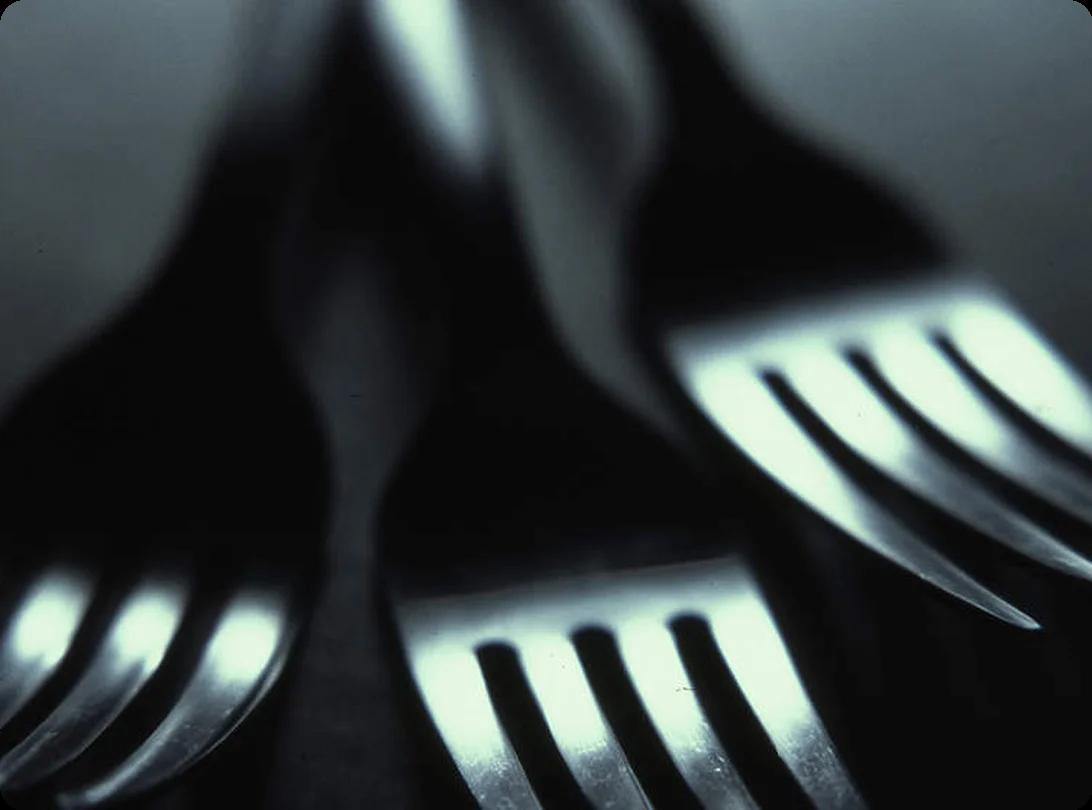 Kitchen drawer organizer filled with utensils being prepared for packing into a moving box