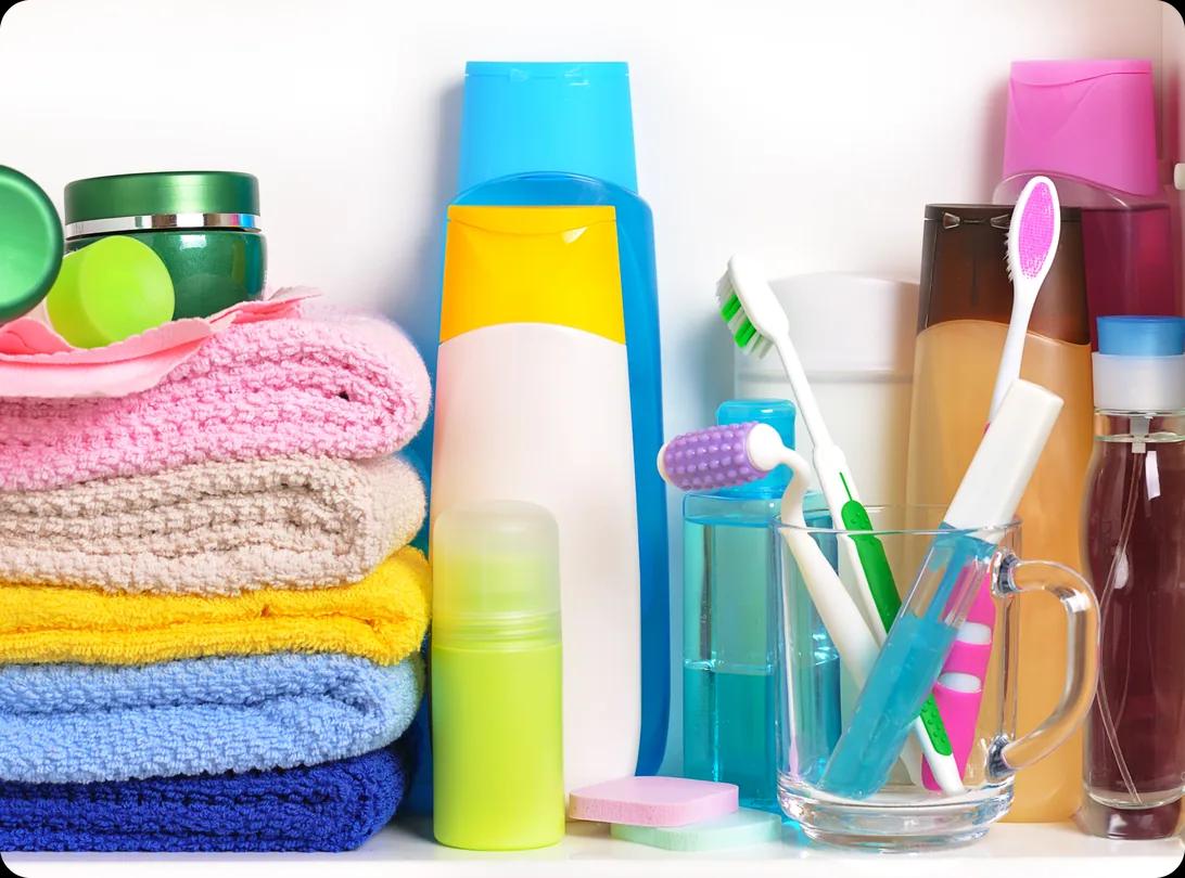 An organized bathroom shelf lined with toiletries and personal care products