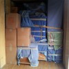 Inside of a moving truck piled high with boxes and furniture