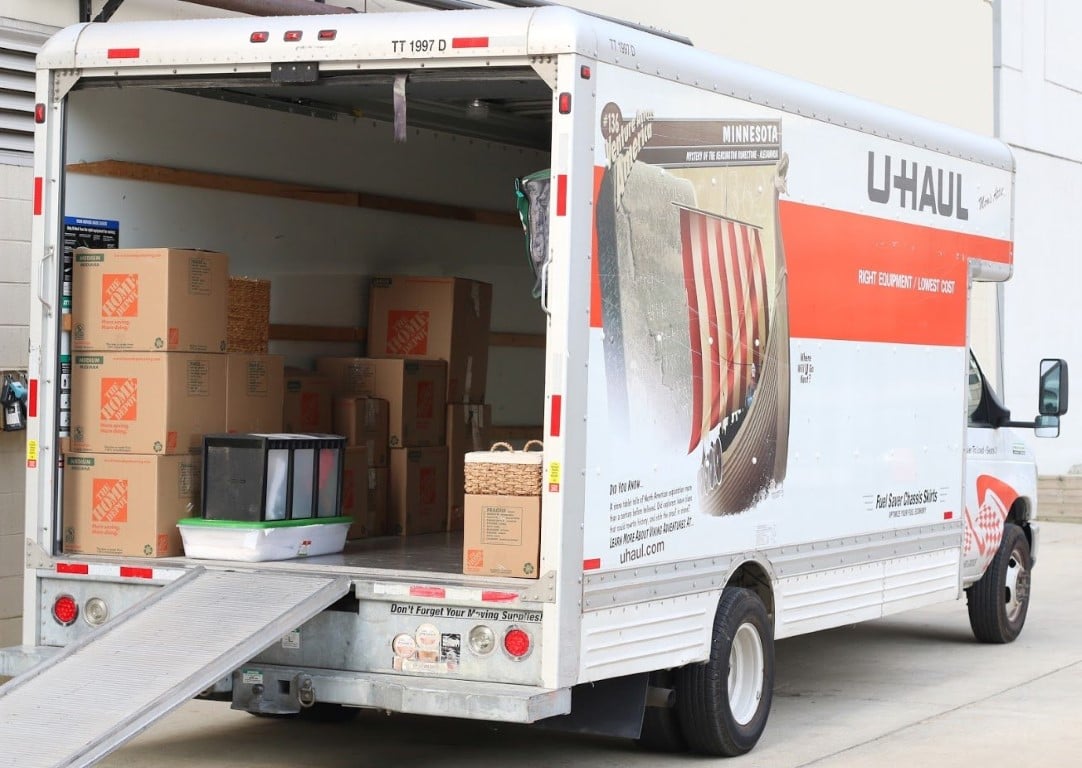 U-Haul truck with the back open getting loaded