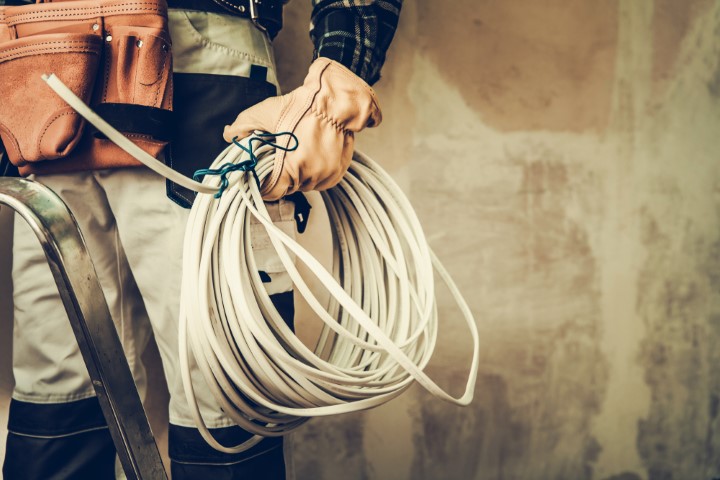 Electrician holding wire