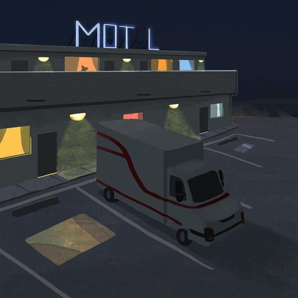 Moving truck parked at a motel at night