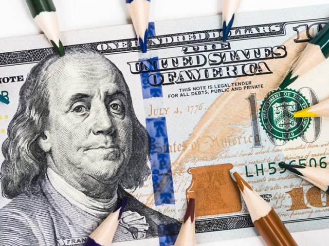 100 Dollar Bill with colored pencils all around it
