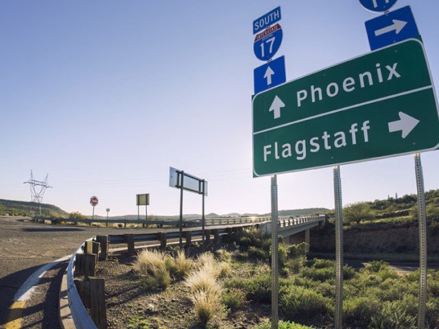 Highway Sign with City Names